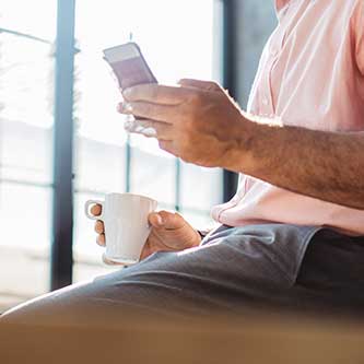 male looking at his phone